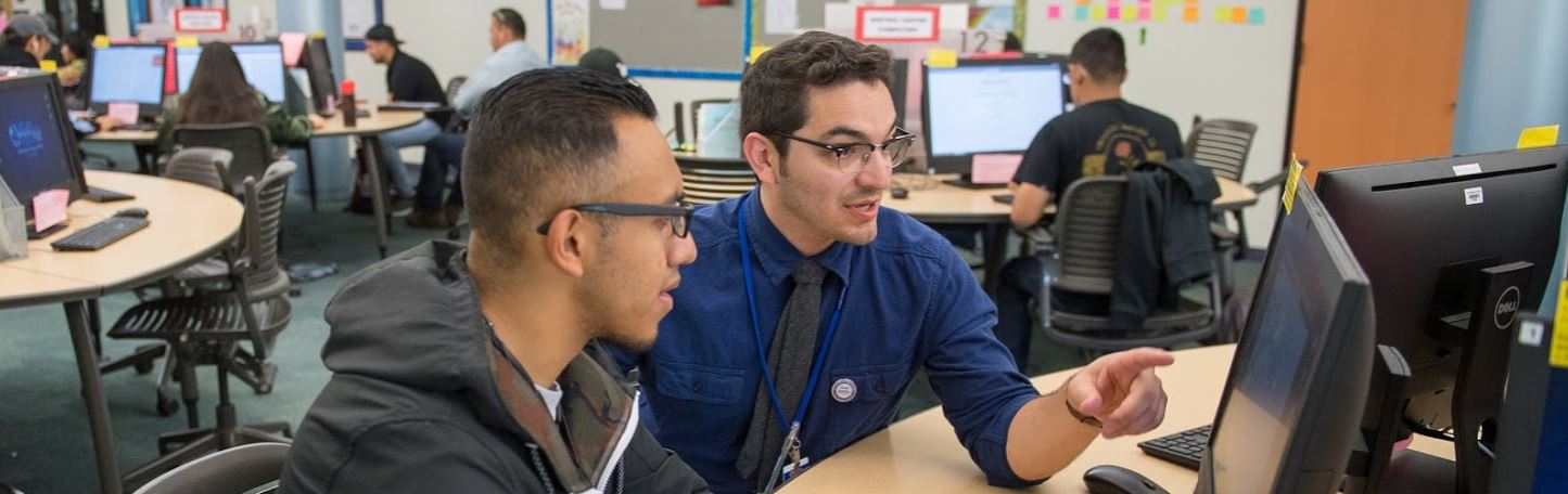 Writing center tutor with student