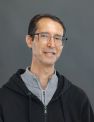Brunette man in black sweatshirt