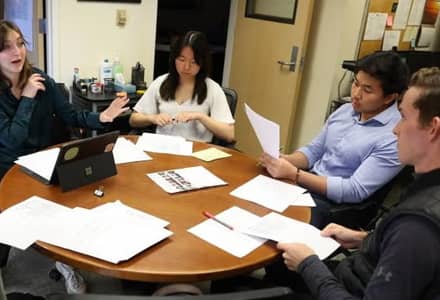 Business students at a table