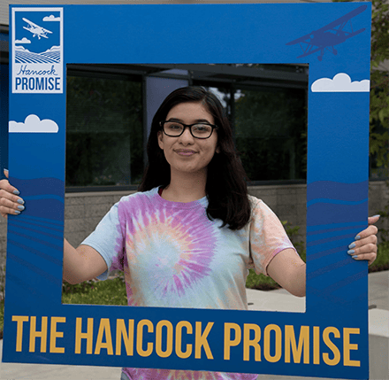 Girl holding Promise sign