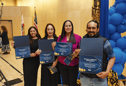 STudents holding certificates