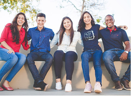 A group of students sitting and smiling